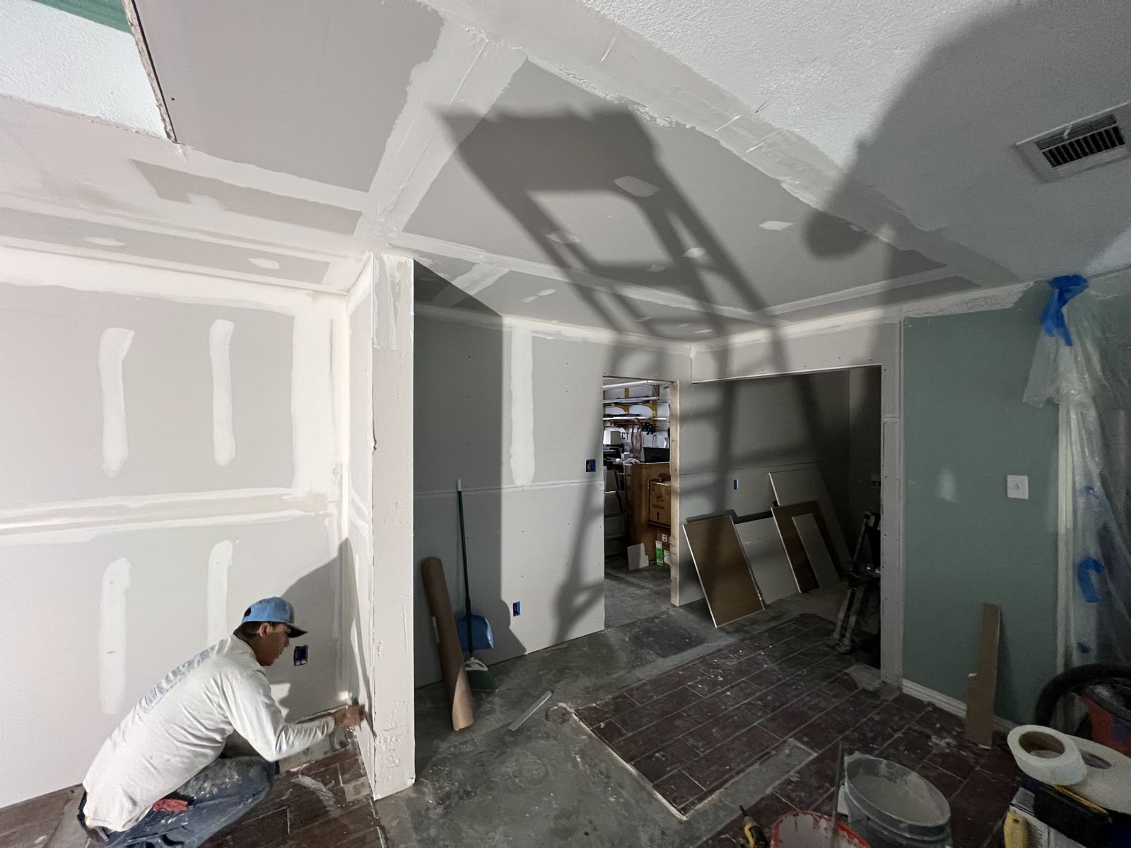 Drywall installation and finishing in progress