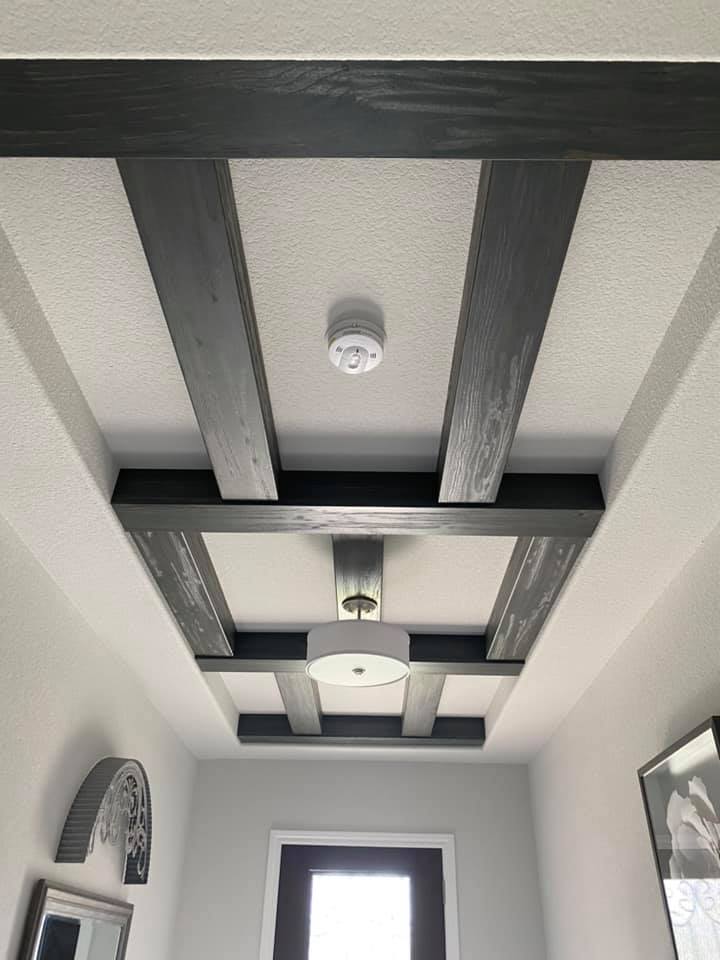 Entryway renovation with tile flooring and updated lighting