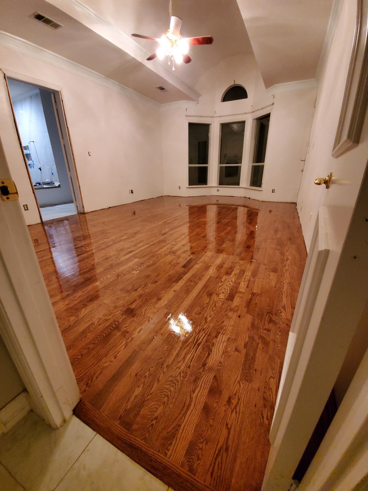 Hardwood floor sanded and refinished to a high gloss