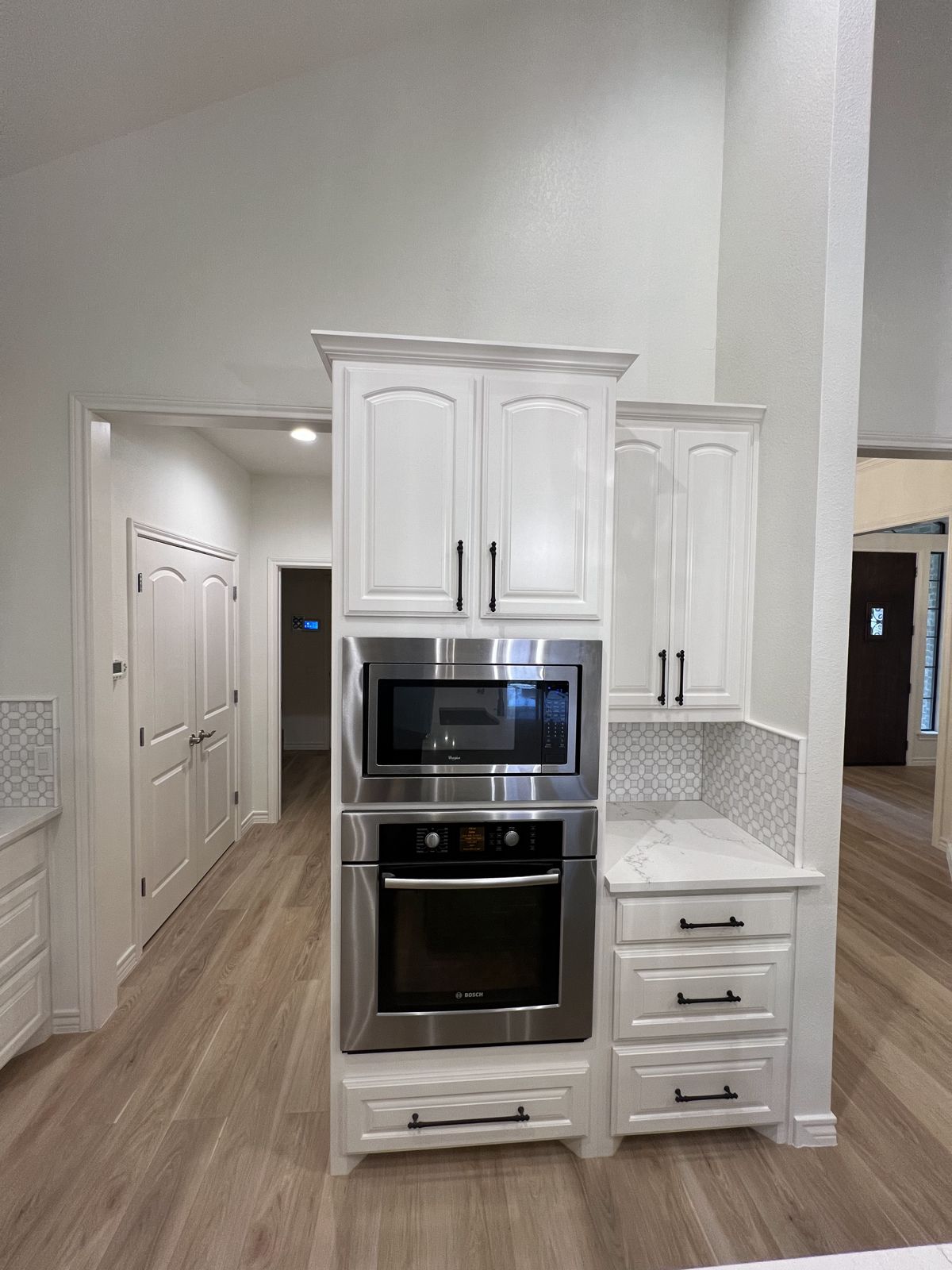 Custom cabinetry with built-in double wall ovens