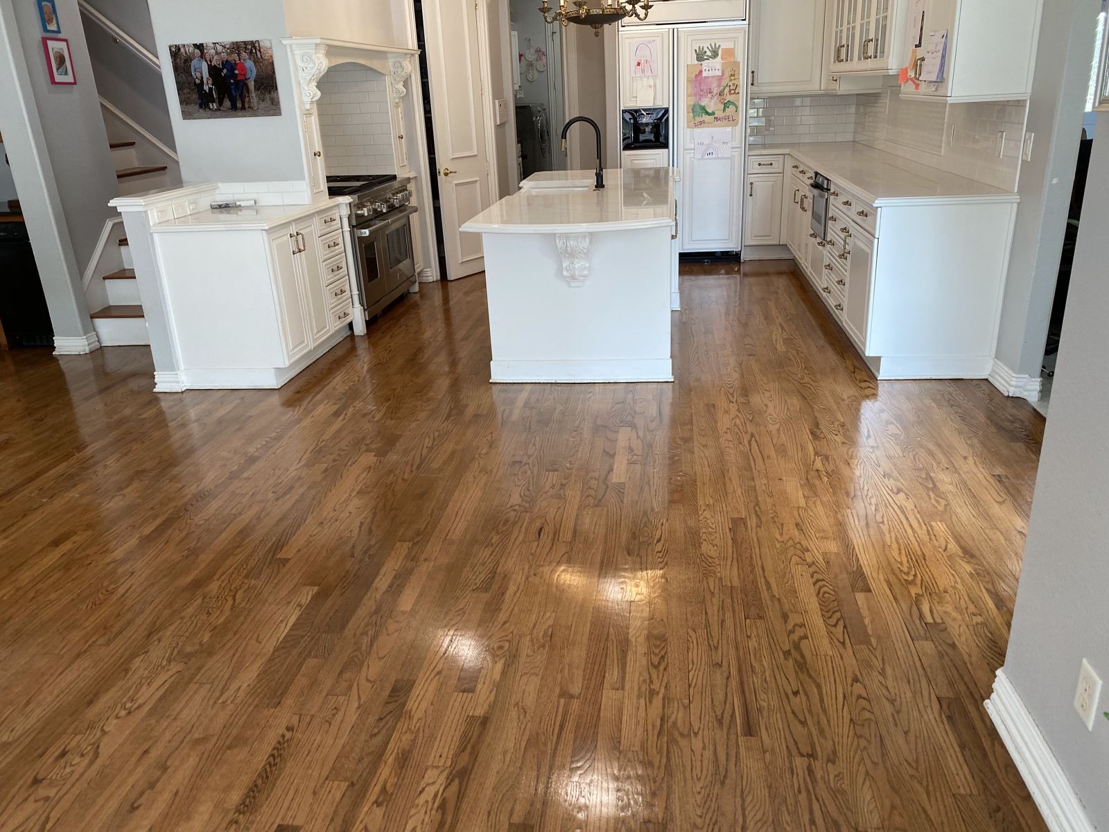 Kitchen and living area with refinished hardwood floors