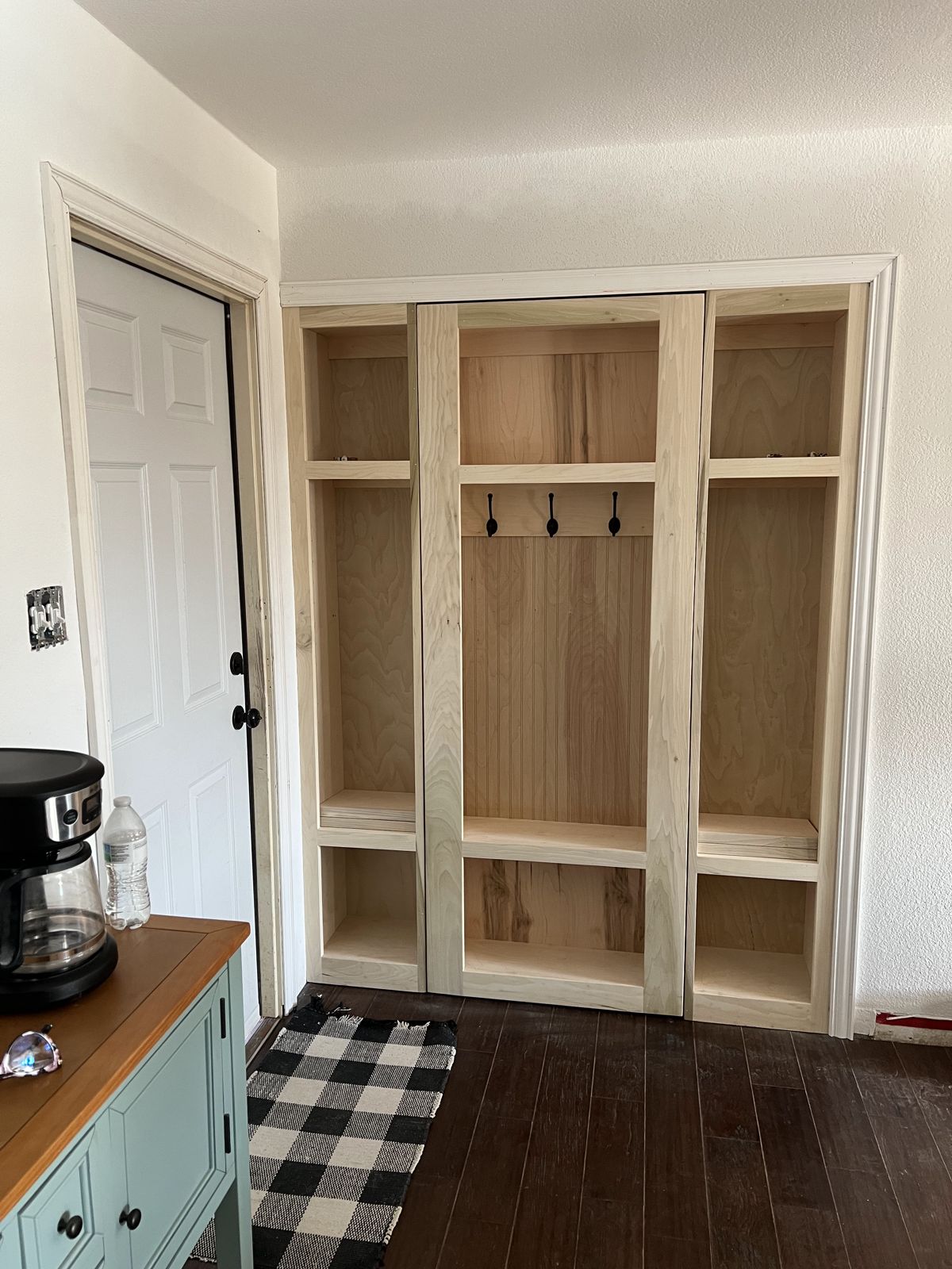 Custom entry lockers and coffee bar with butcher-block counter