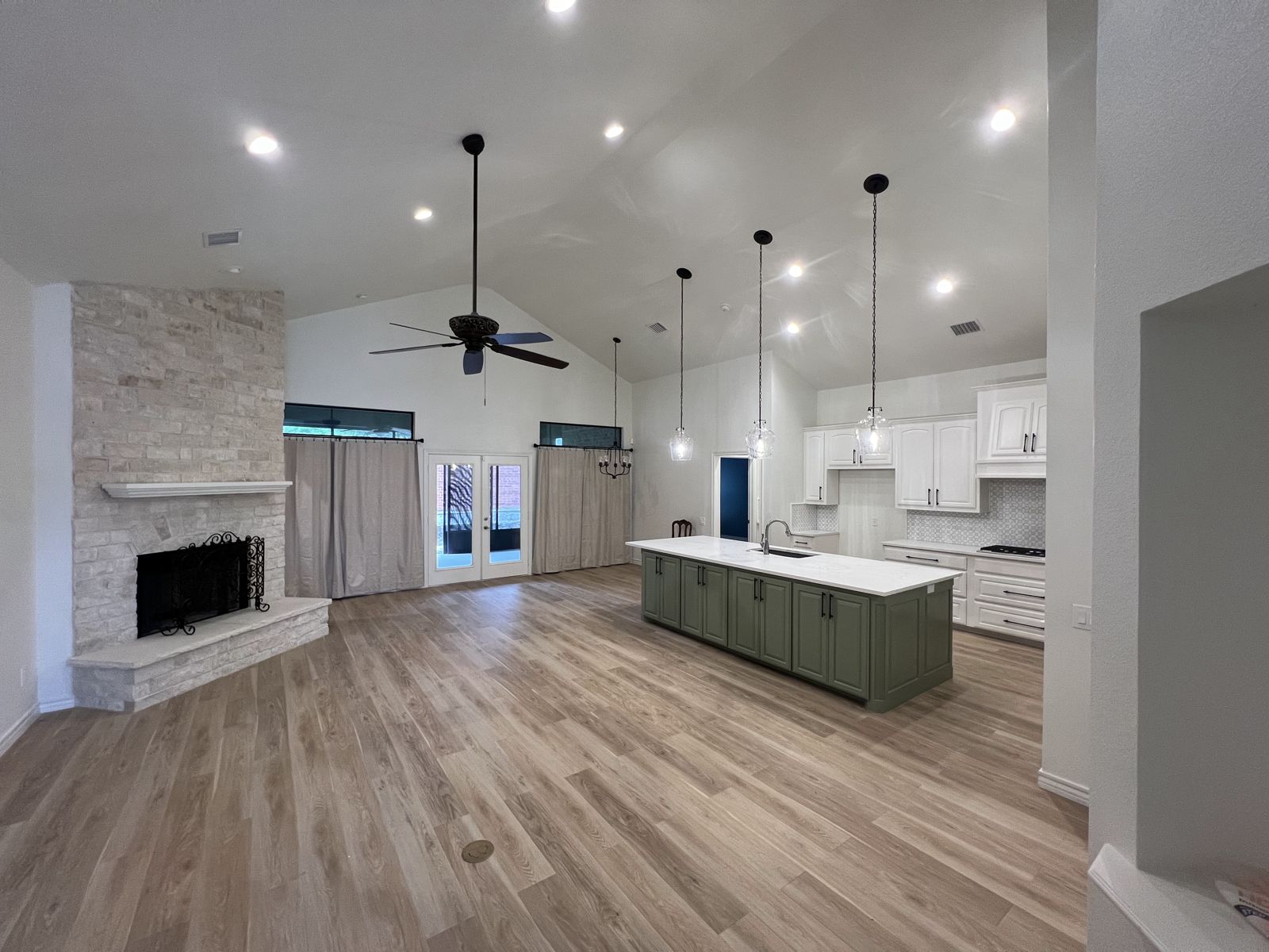 Whole-home remodel with stone fireplace, new flooring and kitchen island